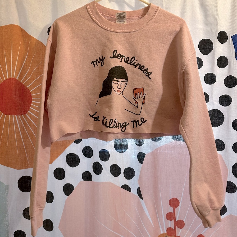 Soft pink, cropped sweatshirt. Sized M.